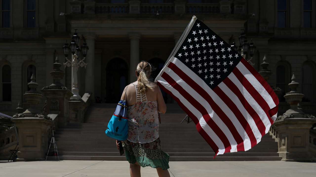 People gather in Lansing for a March for Medical Freedom rally