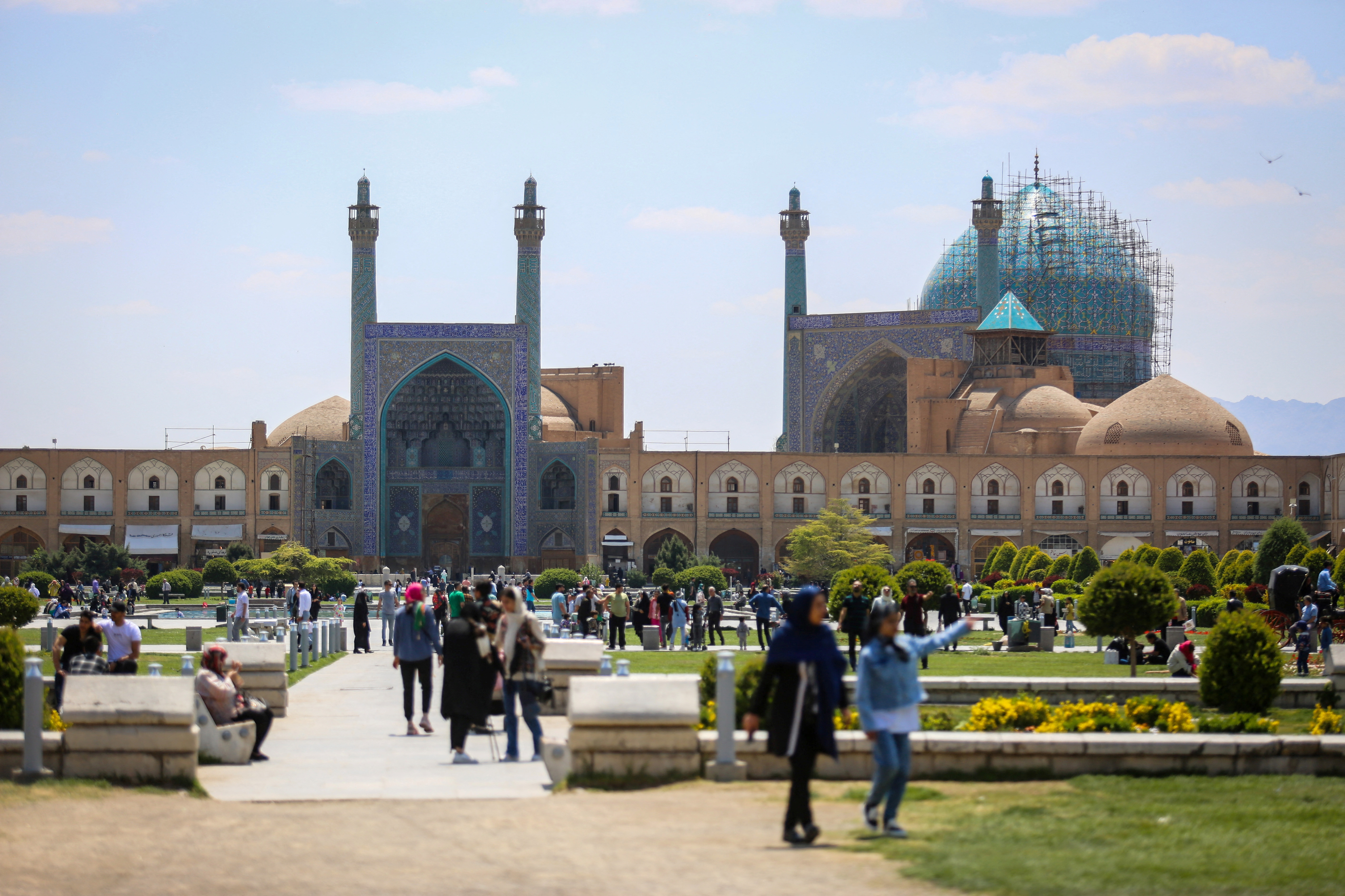 People walk on Naqsh-e Jahan Square, after a reported Israeli attack on Iran, in Isfahan Province