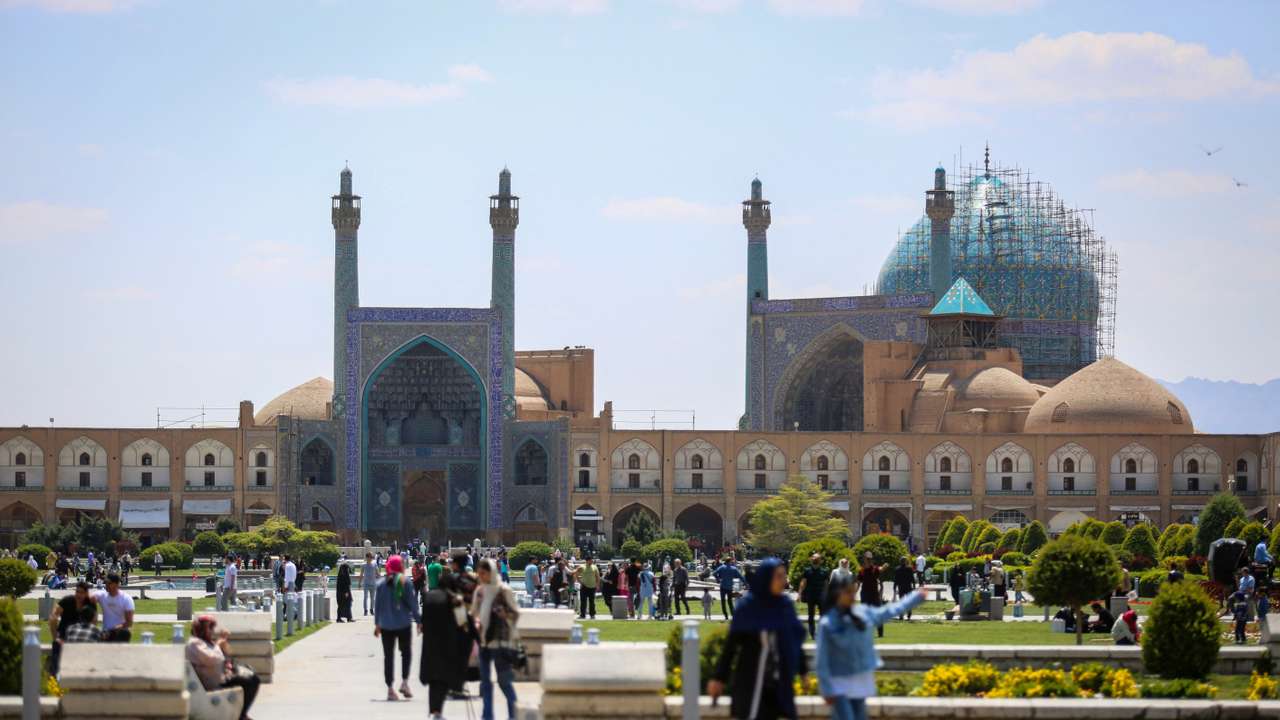 People walk on Naqsh-e Jahan Square, after a reported Israeli attack on Iran, in Isfahan Province