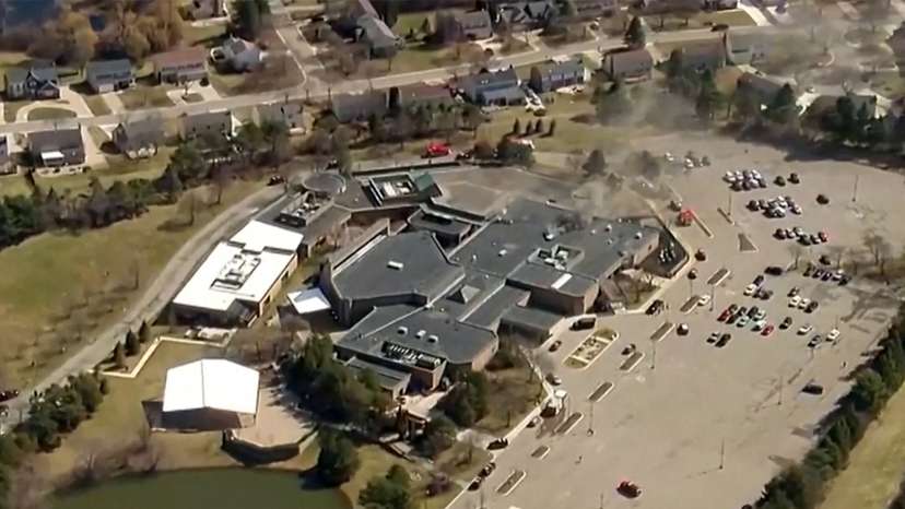 Smoke rises from the building after an active shooting incident was reported at the Temple Israel Synagogue in West Bloomfield