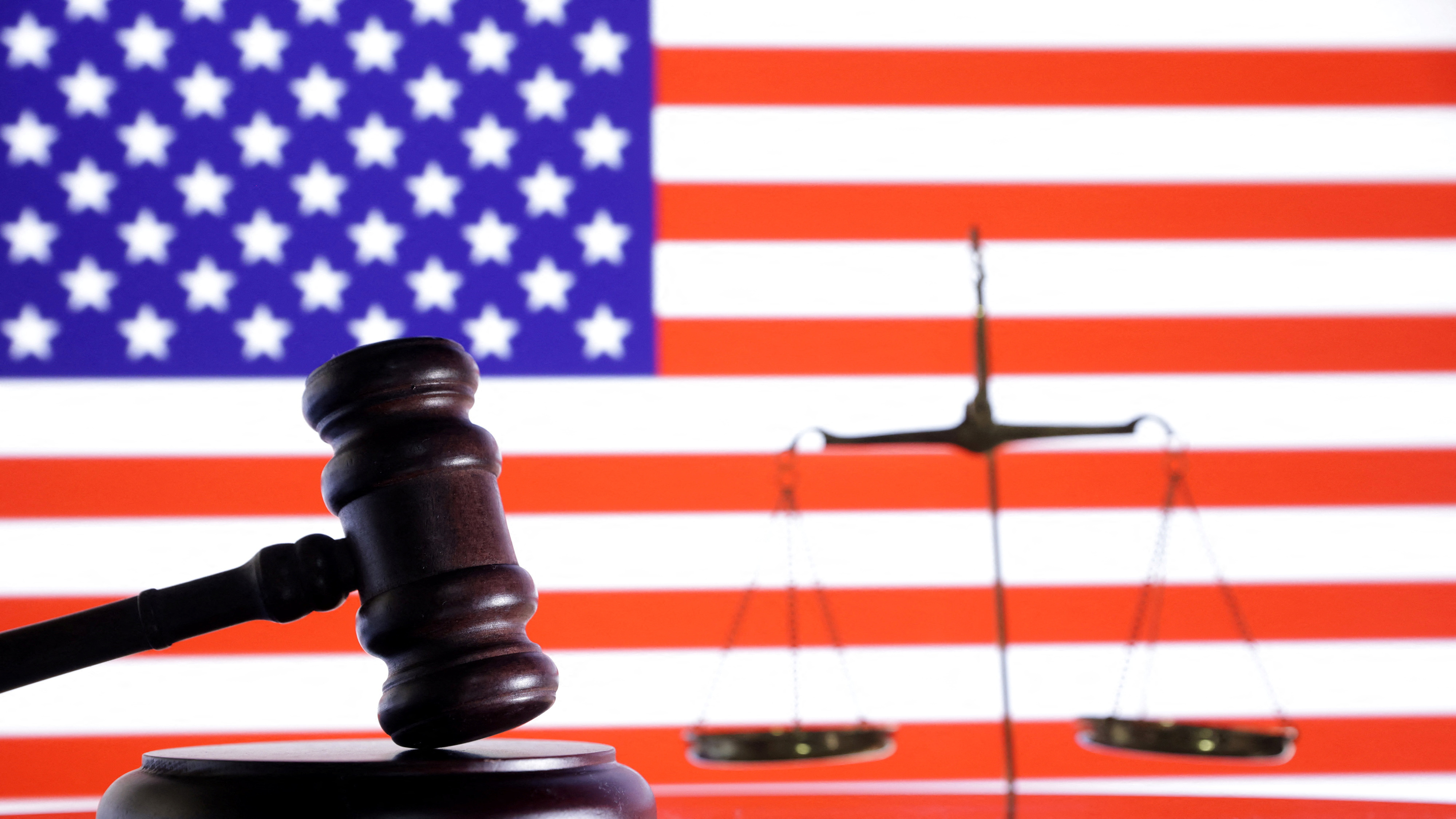 Illustration shows U.S. flag, a judge gavel and a vintage scale