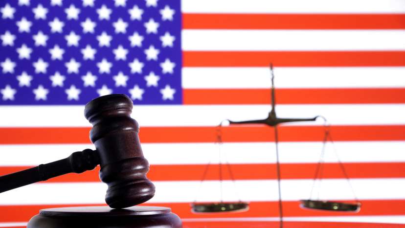 Illustration shows U.S. flag, a judge gavel and a vintage scale