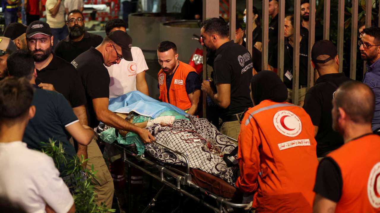 A person is carried outside American University of Beirut Medical Center, including Hezbollah fighters and medics, were wounded and killed when the pagers they use to communicate exploded across Lebanon, according to a security source, in Beirut