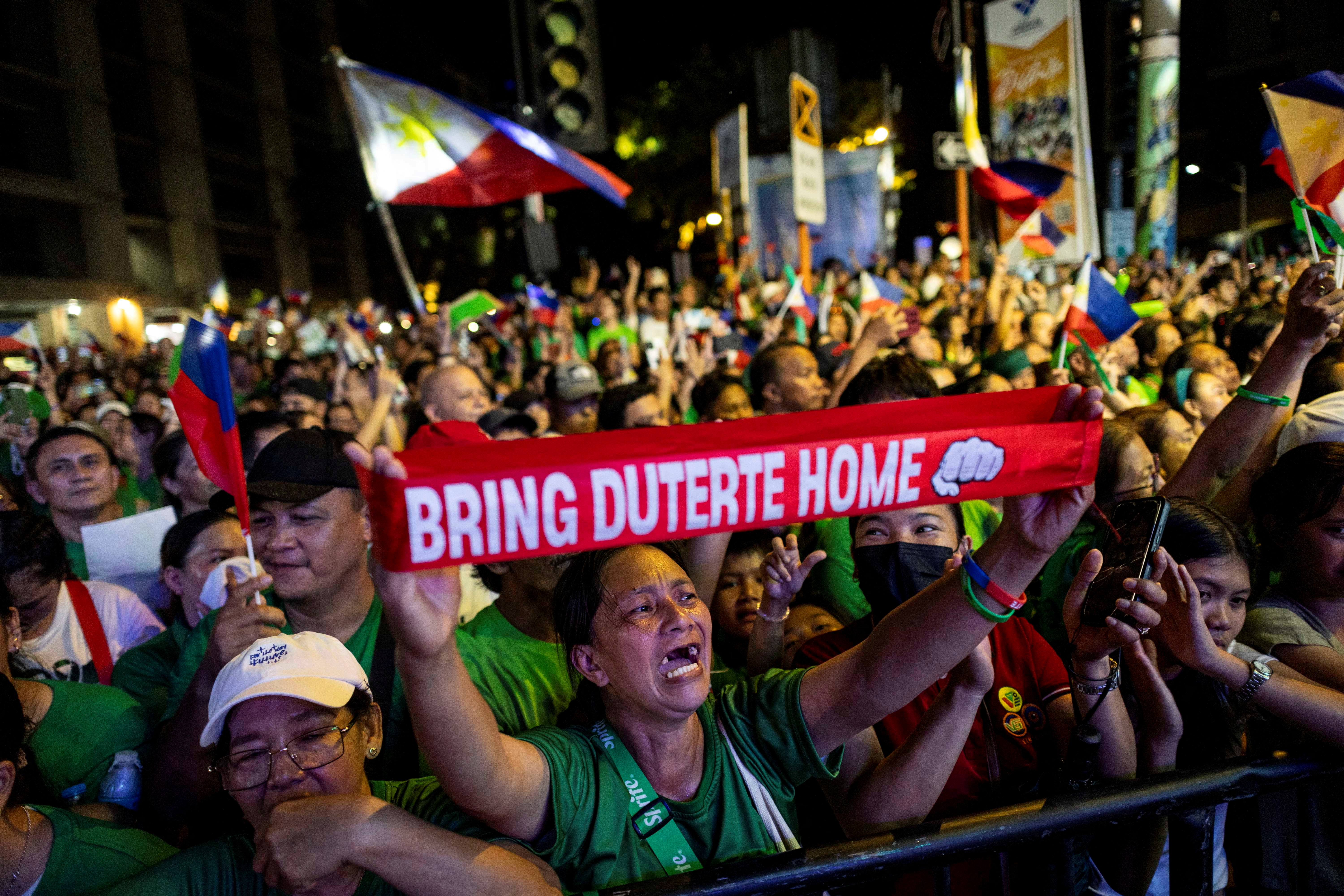 FILE PHOTO: In custody in the Hague, on ballot at home: Duterte's grip on Philippines endures
