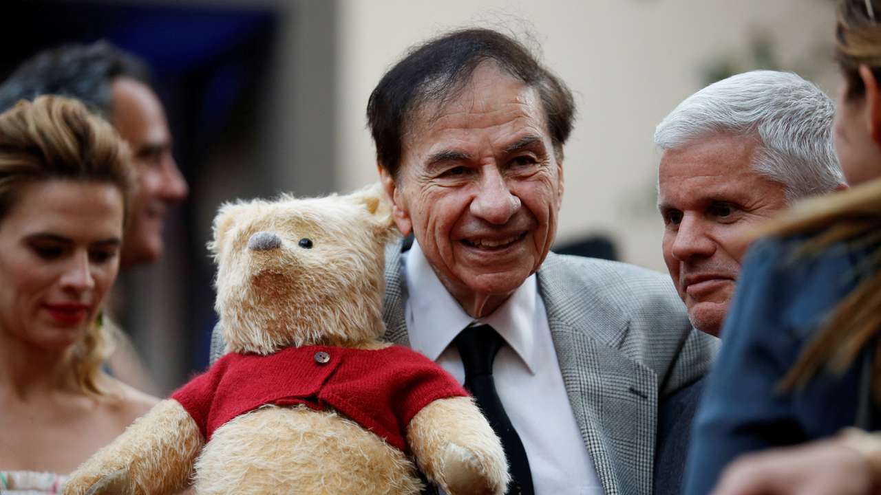 FILE PHOTO: Songwriter Richard M. Sherman holds a stuffed Winnie the Pooh as he poses at the world premiere of Disney's "Christopher Robin," in Burbank