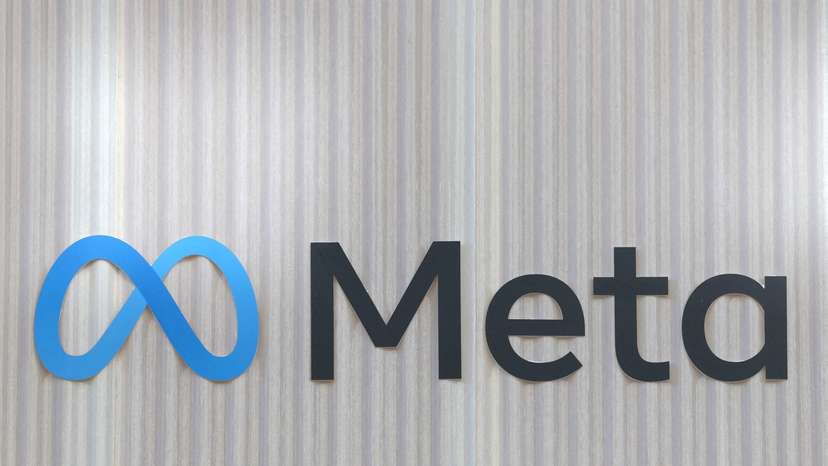 FILE PHOTO: The logo of Meta is seen at the entrance of the company's temporary stand ahead of WEF in Davos