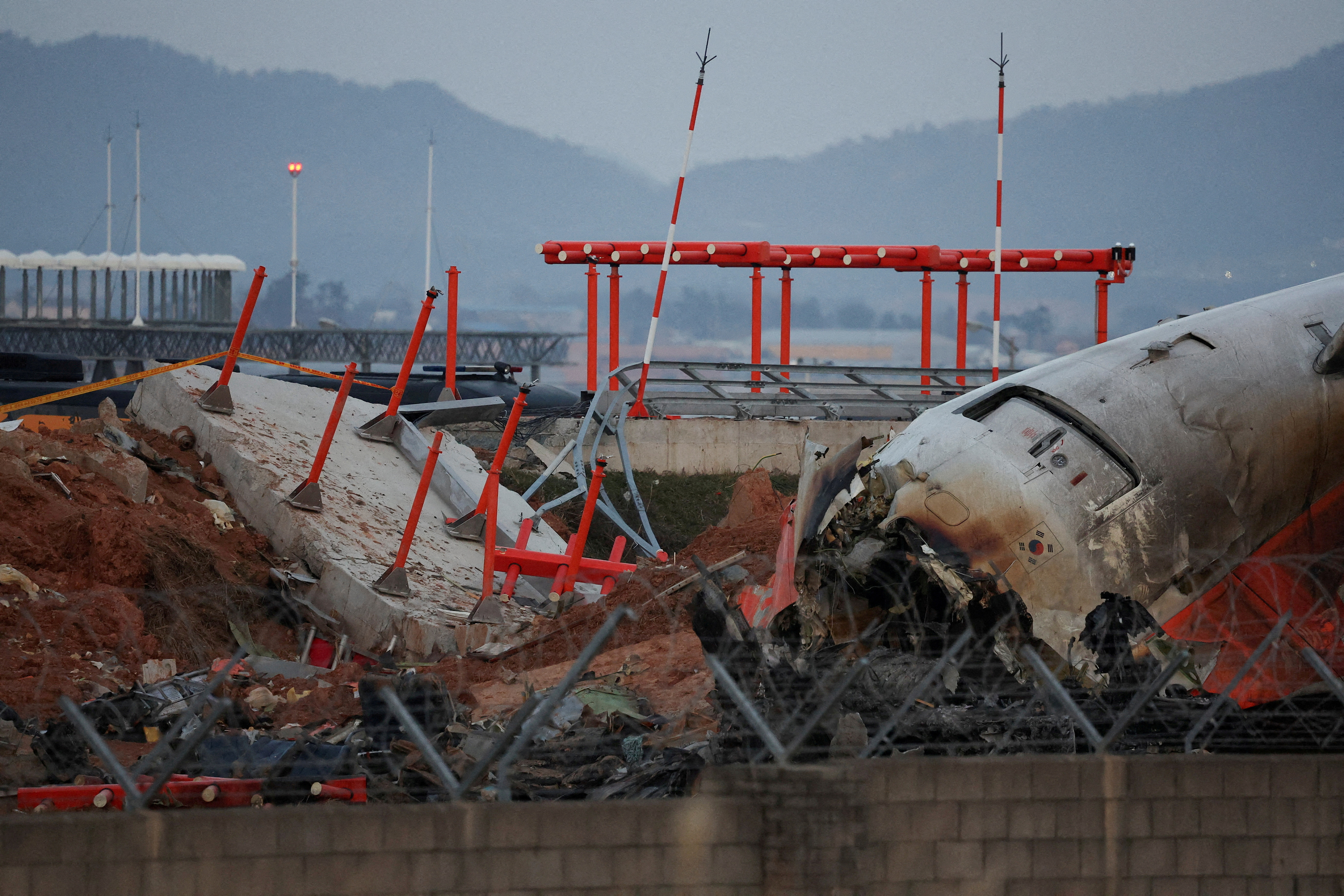 FILE PHOTO: Wreckage of crashed Jeju Air aircraft in Muan, South Korea