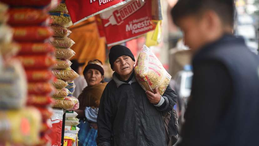 Bolivians fear 'total crisis' as big state economic model implodes, in La Paz