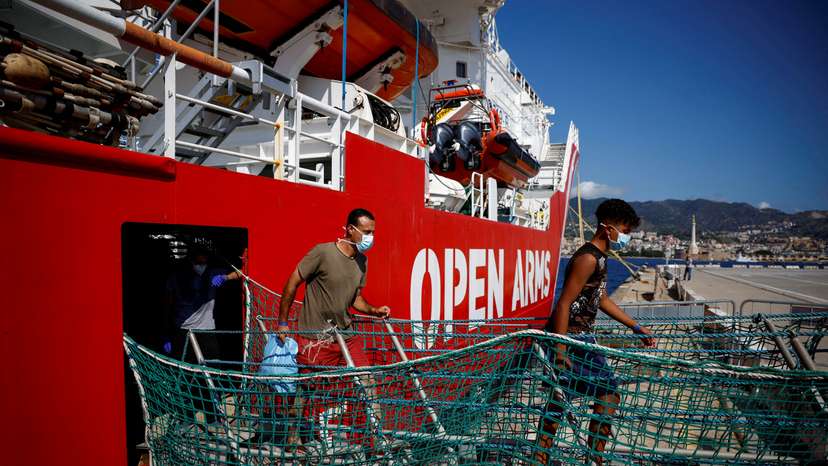 FILE PHOTO: Migrants on board Open Arms rescue boat arrive at Messina port