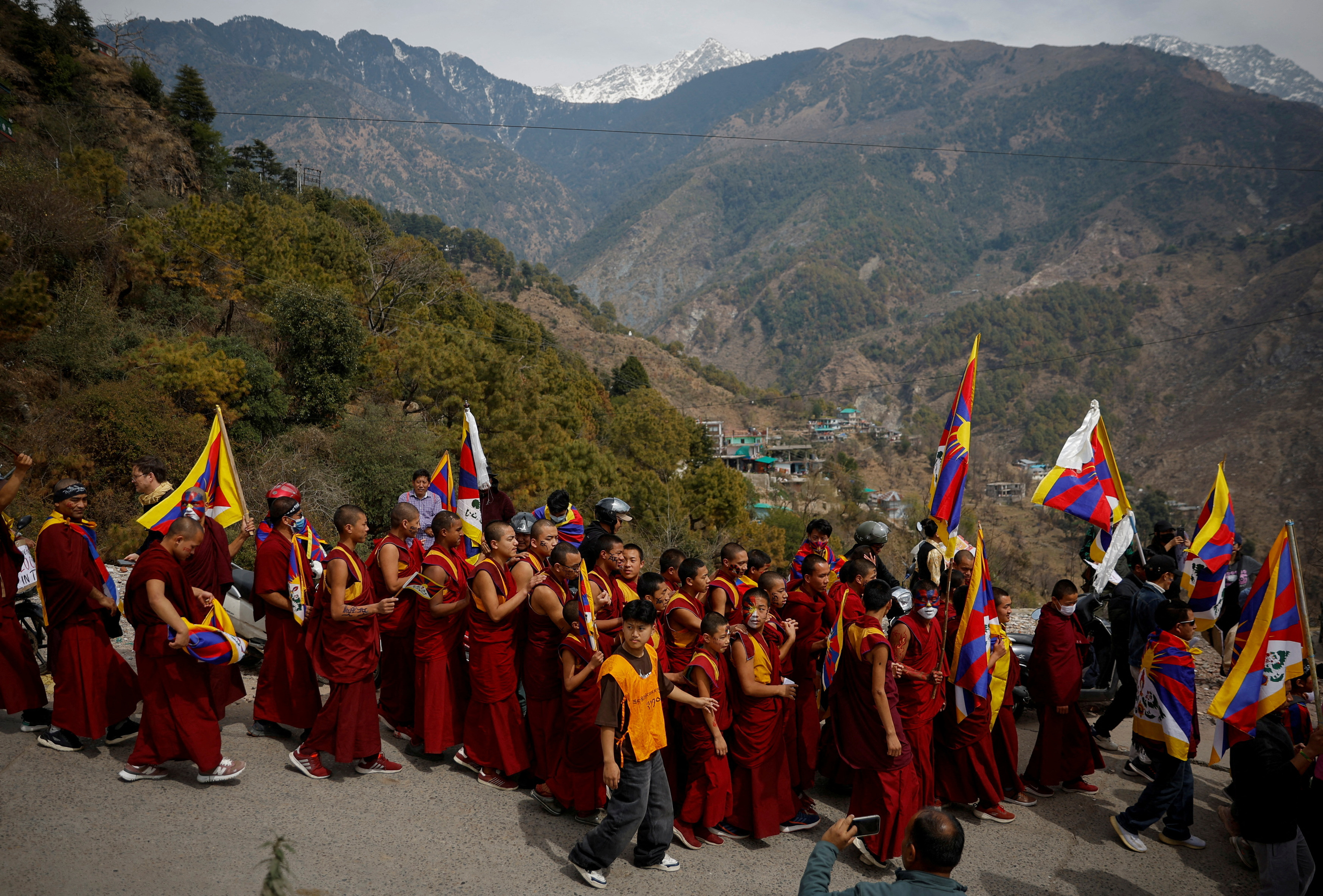 FILE PHOTO: Tibetan participate in a march to mark the 65th anniversary of the uprising in Dharamsala