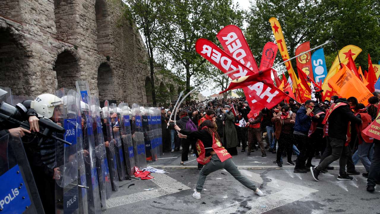 Protesters scuffle with riot police as they attempt to defy a ban and march on Taksim Square to celebrate May Day in Istanbul