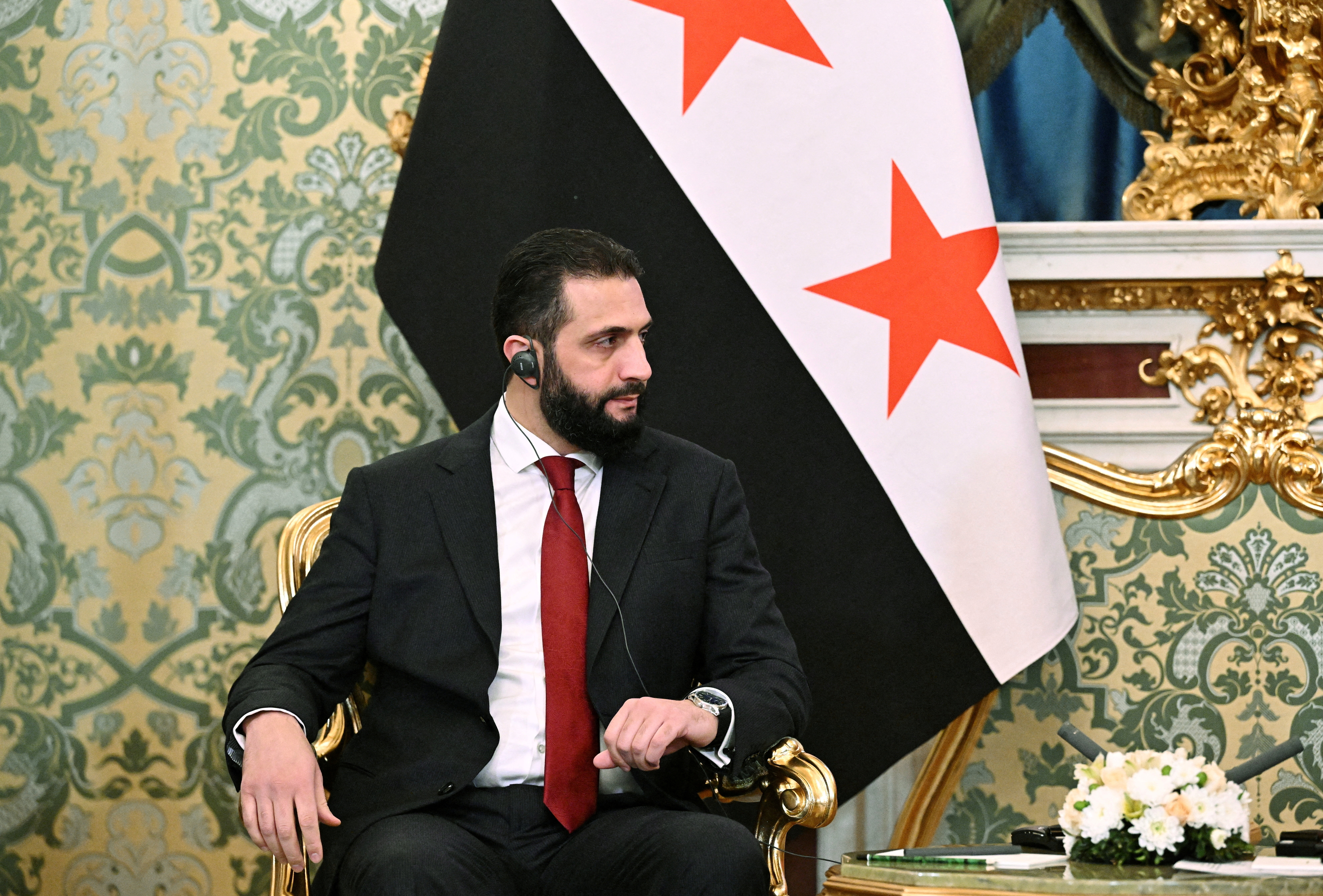 FILE PHOTO: Syria's President Ahmed al-Sharaa attends a meeting with Russia's President Vladimir Putin in Moscow,
