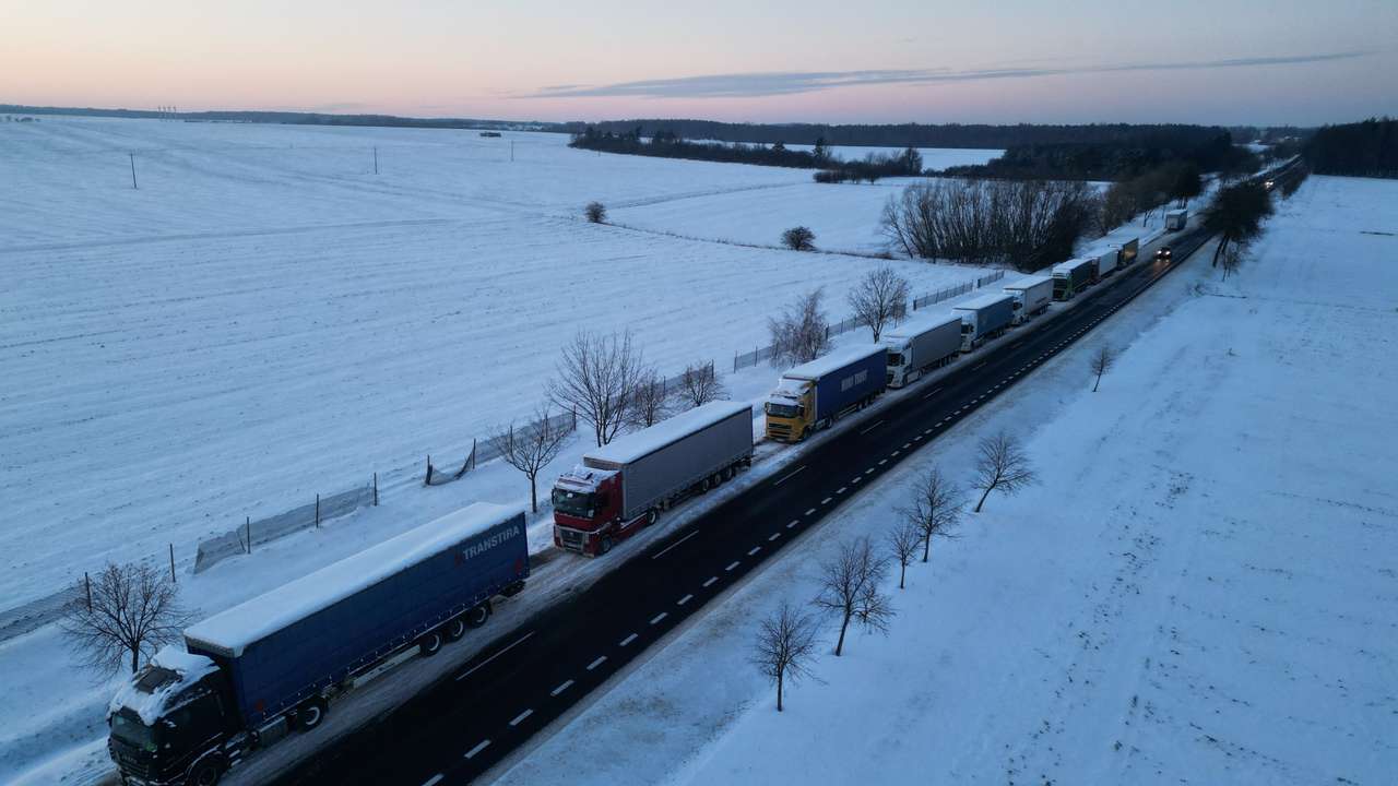 Trucks line up in a long queue to cross the Polish-Ukrainian border at the Hrebenne-Rawa Ruska crossing in Potoki