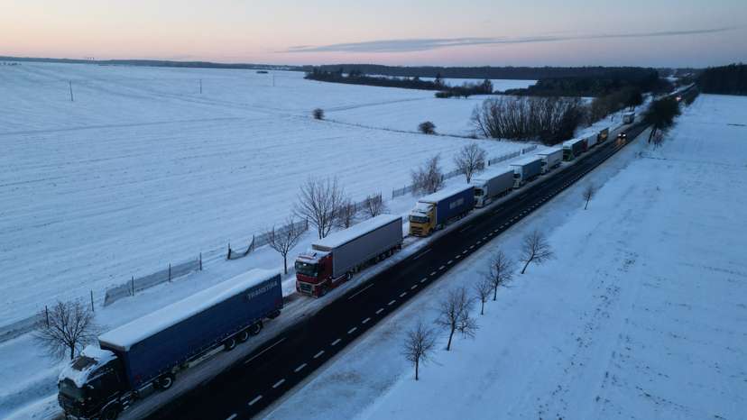 Trucks line up in a long queue to cross the Polish-Ukrainian border at the Hrebenne-Rawa Ruska crossing in Potoki