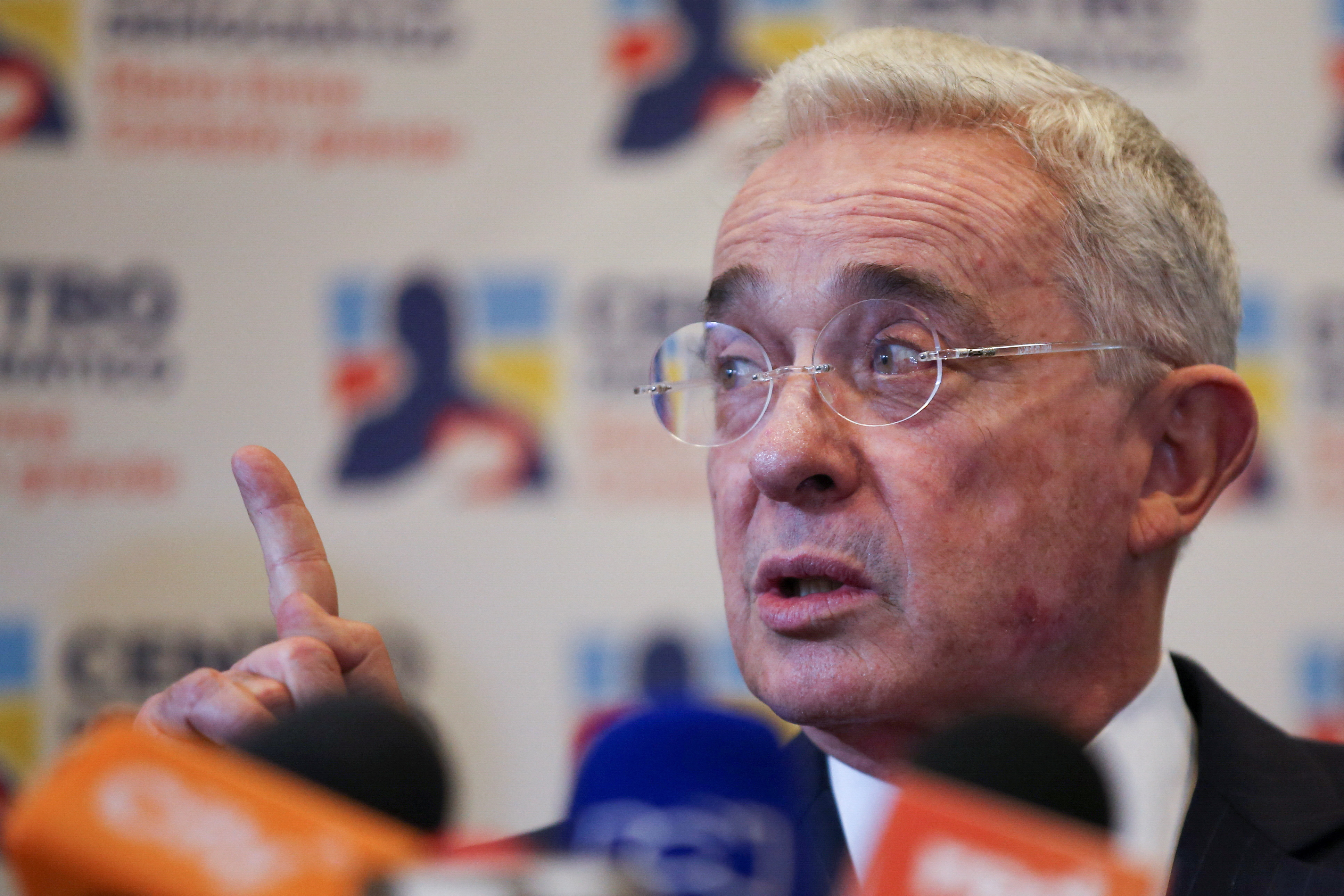 Colombia's former president Alvaro Uribe speaks to the media after his meeting with President-elect Gustavo Petro in Bogota