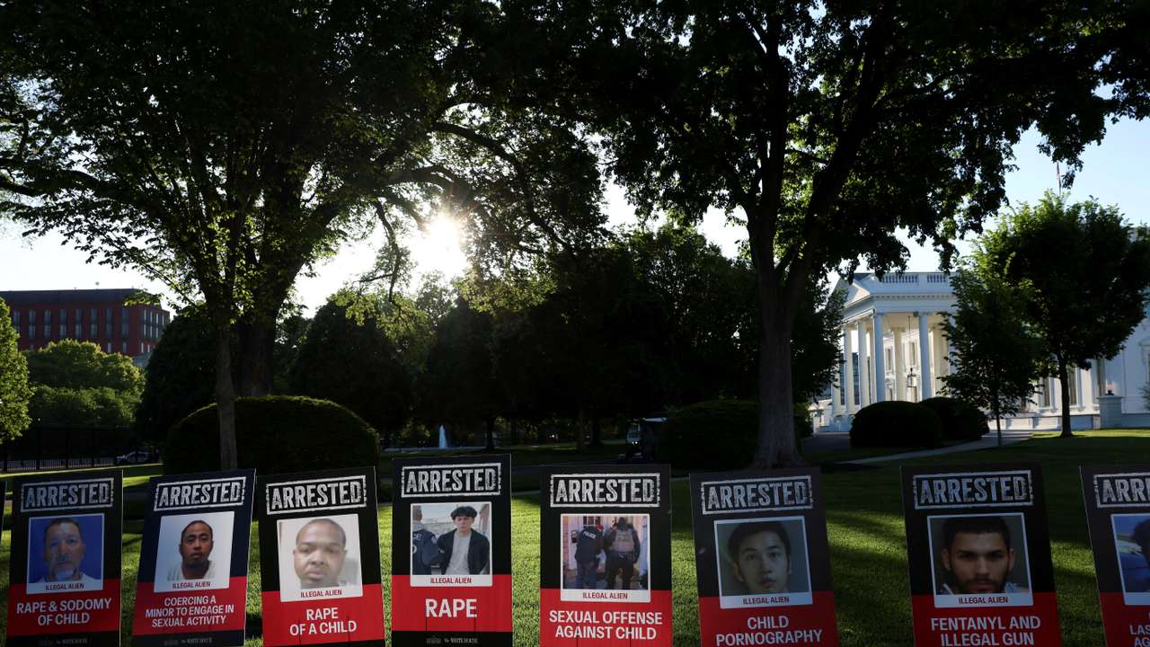 Posters of people described as arrested illegal immigrants are displayed outside the White House in Washington