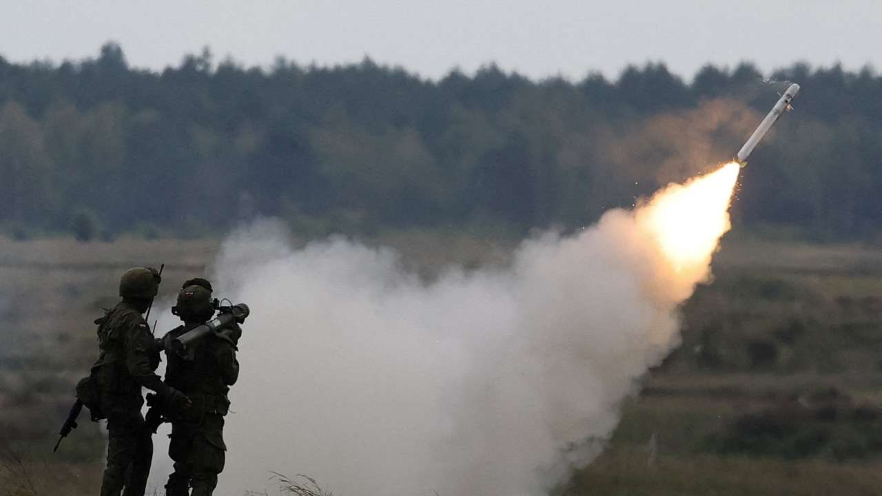 FILE PHOTO: Polish forces with NATO soldiers hold military exercises 'Iron Defender' at Orzysz training ground in Wierzbiny