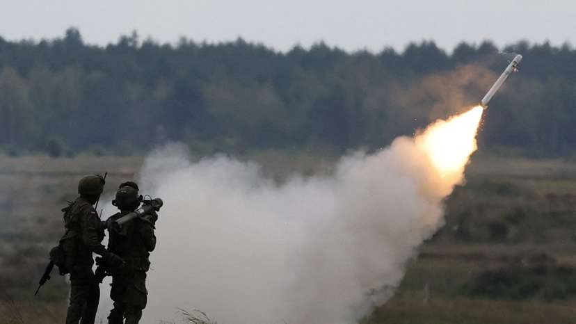 FILE PHOTO: Polish forces with NATO soldiers hold military exercises 'Iron Defender' at Orzysz training ground in Wierzbiny