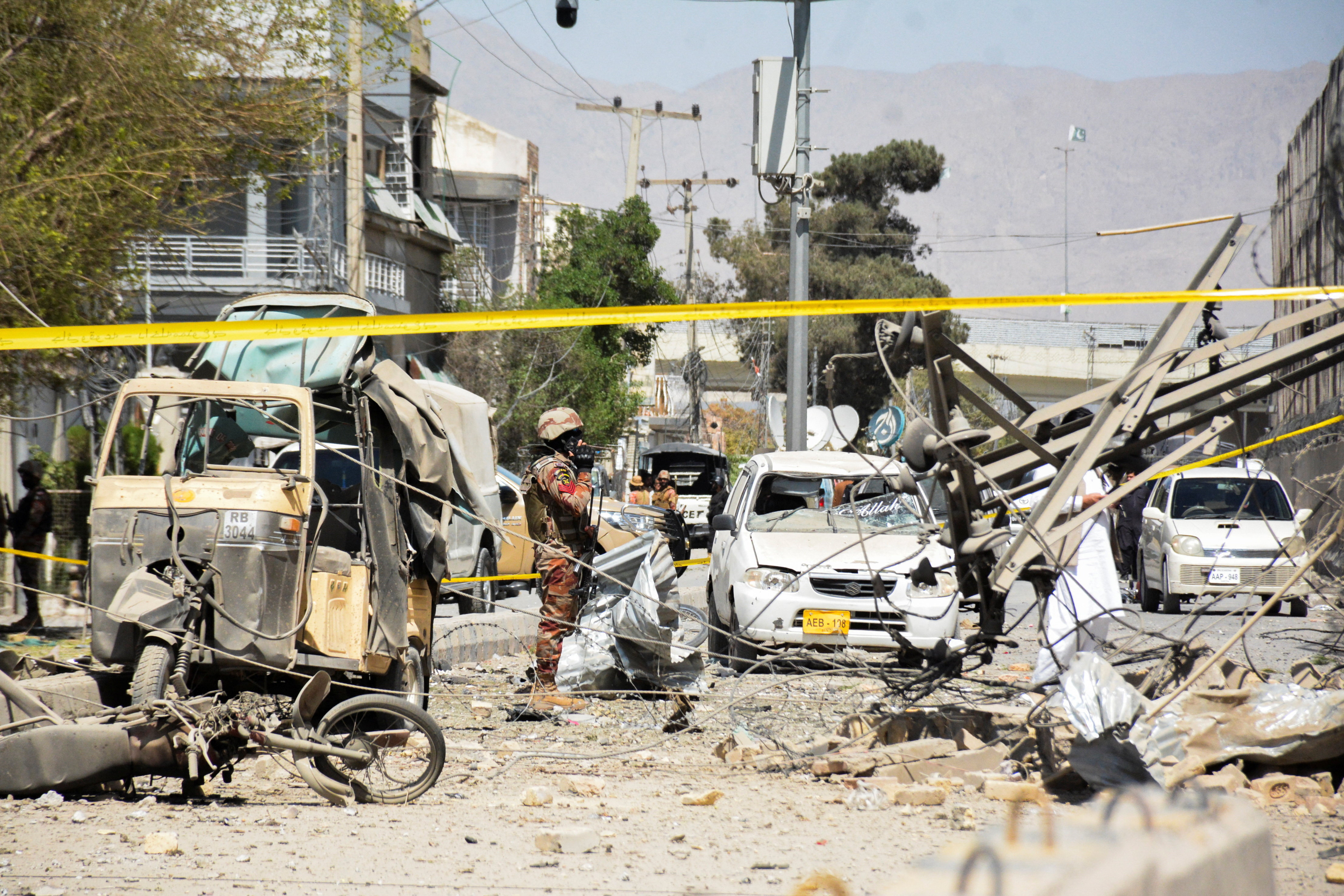 Paramilitary soldier stands amid the debris after a bomb blast near the Frontier Corps headquarters in Quetta