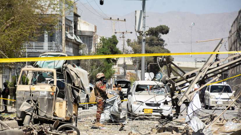 Paramilitary soldier stands amid the debris after a bomb blast near the Frontier Corps headquarters in Quetta