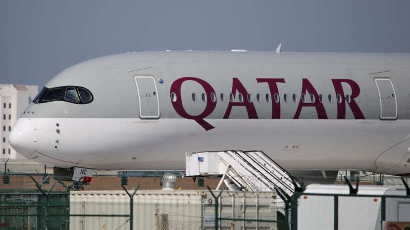 FILE PHOTO: A Qatar Airways plane sits on the tarmac at Los Angeles International Airport (LAX)