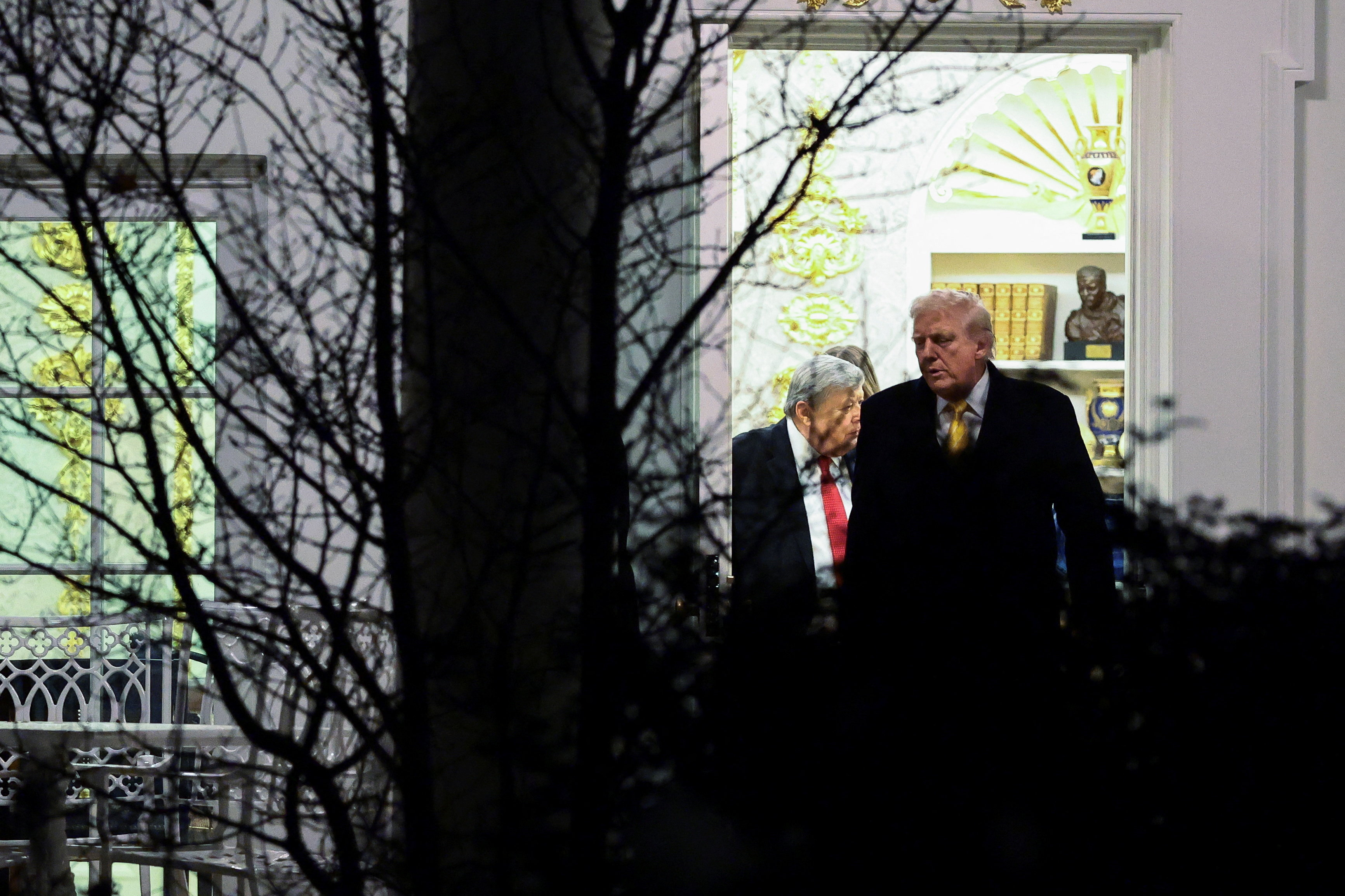 U.S. President Donald Trump walks out of the Oval Office towards Marine One at the White House in Washington, D.C.