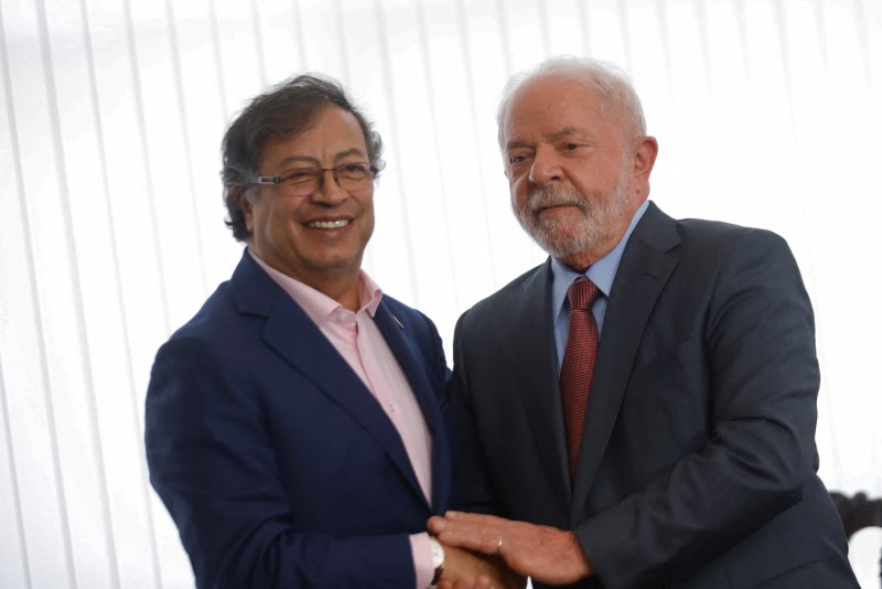 Brazil's President Luiz Inacio Lula da Silva holds hands with Colombian President Gustavo Petro during a bilateral meeting at the Itamaraty Palace in Brasilia