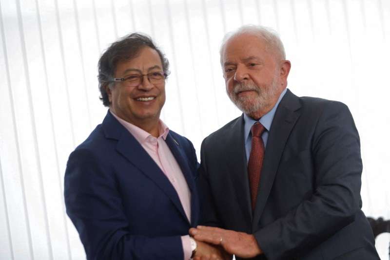 Brazil's President Luiz Inacio Lula da Silva holds hands with Colombian President Gustavo Petro during a bilateral meeting at the Itamaraty Palace in Brasilia