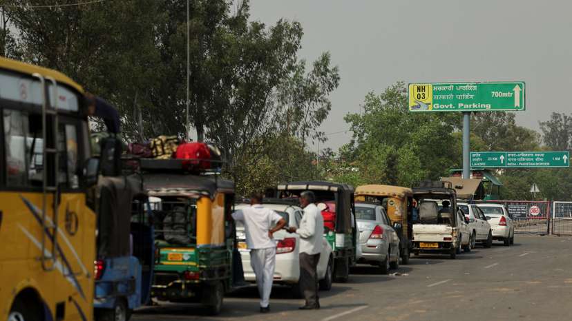 Vehicles wait in a line before making their way to Pakistan at the Attari-Wagah border crossing near Amritsar