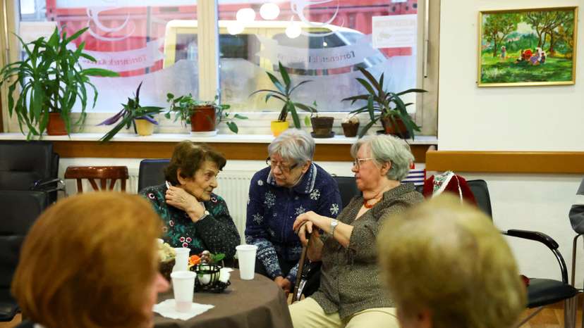 Elderly women talk in a pensioners club in Budapest