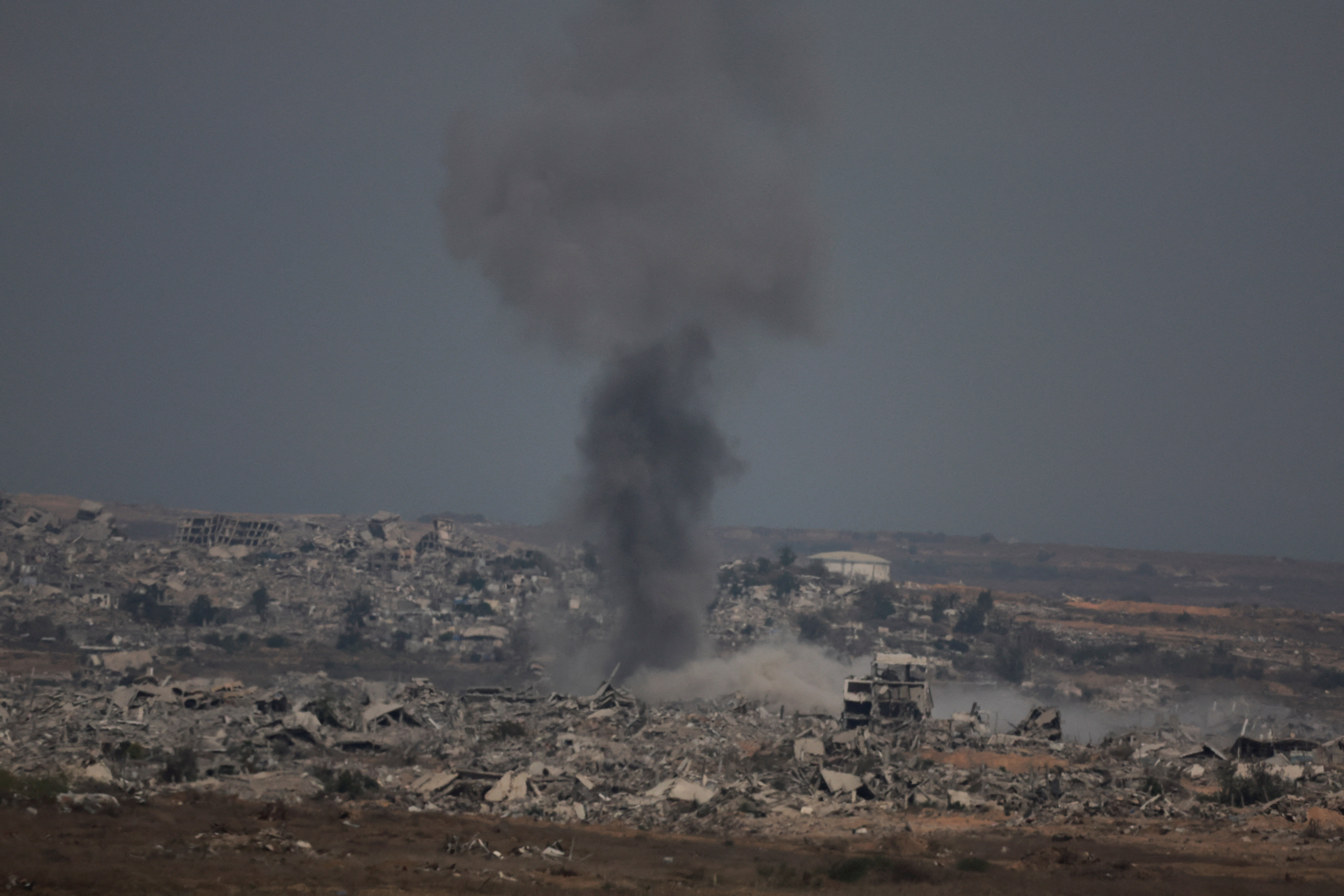 Smoke rises after an Israeli air strike in north Gaza, as seen from Israel's border with Gaza