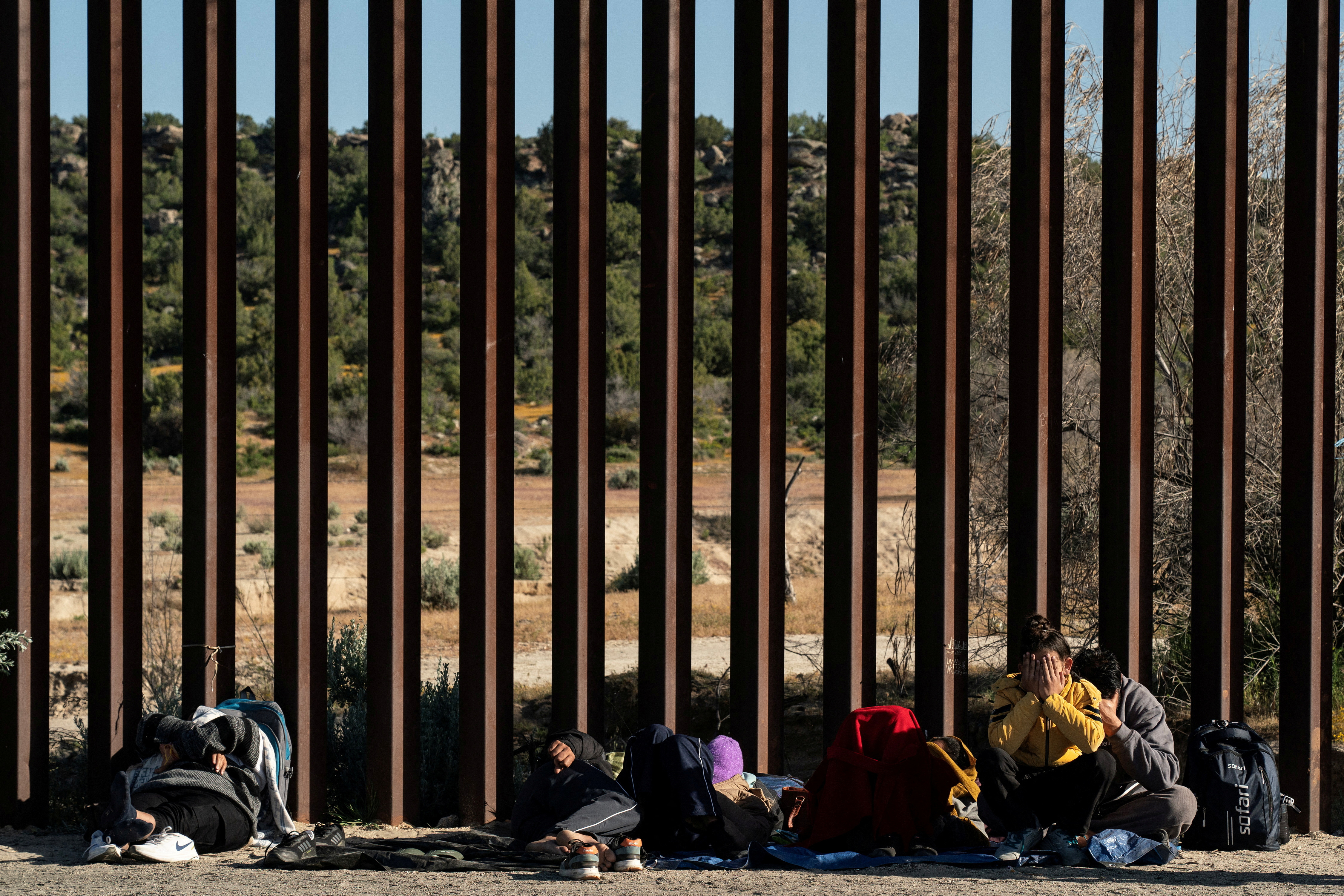 FILE PHOTO: Migrants continue to cross U.S.-Mexico border in California