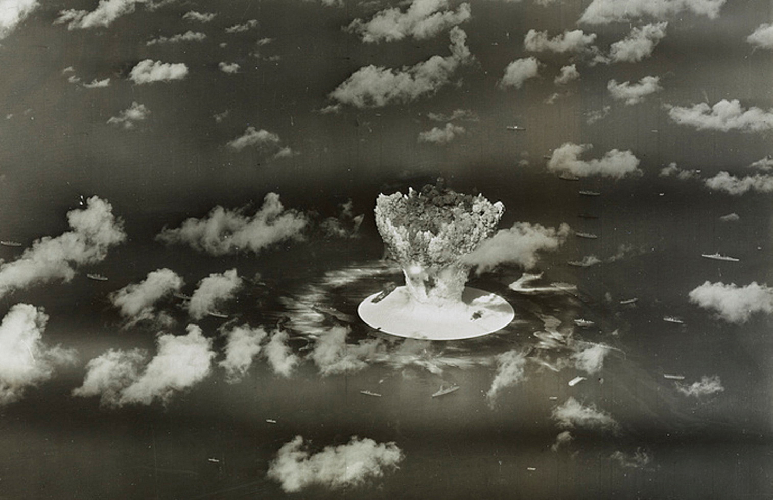 FILE PHOTO: Handout of a mushroom cloud rises with ships below during Operation Crossroads nuclear weapons test on Bikini Atoll