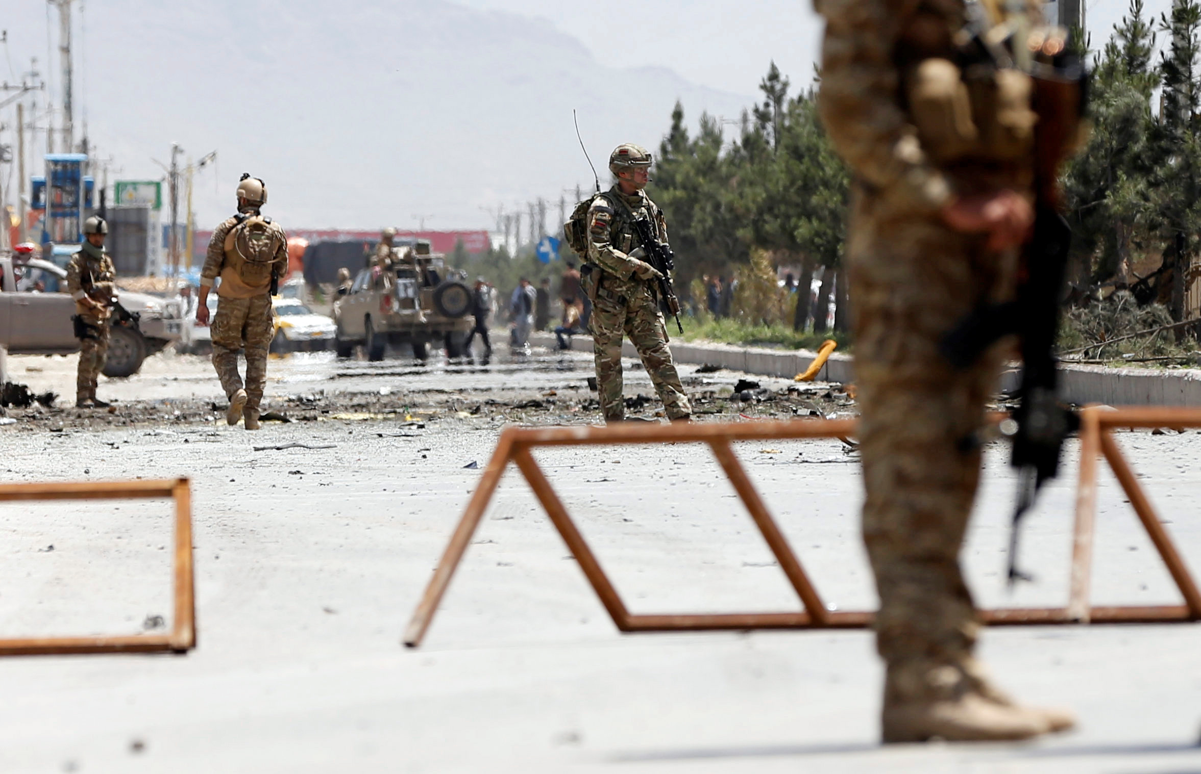 Afghan security forces and a British soldier in Kabul, Afghanistan