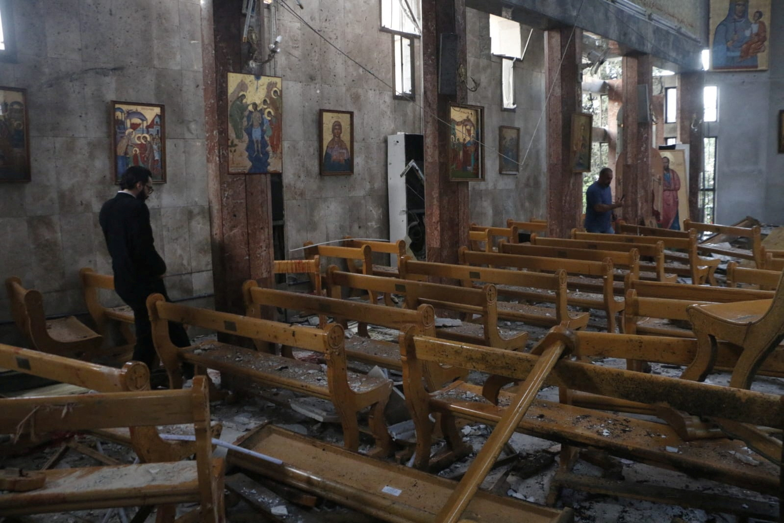 People inspect the damage after a blast rocked the Mar Elias Church according to witnesses, in the Dweila neighbourhood of Damascus