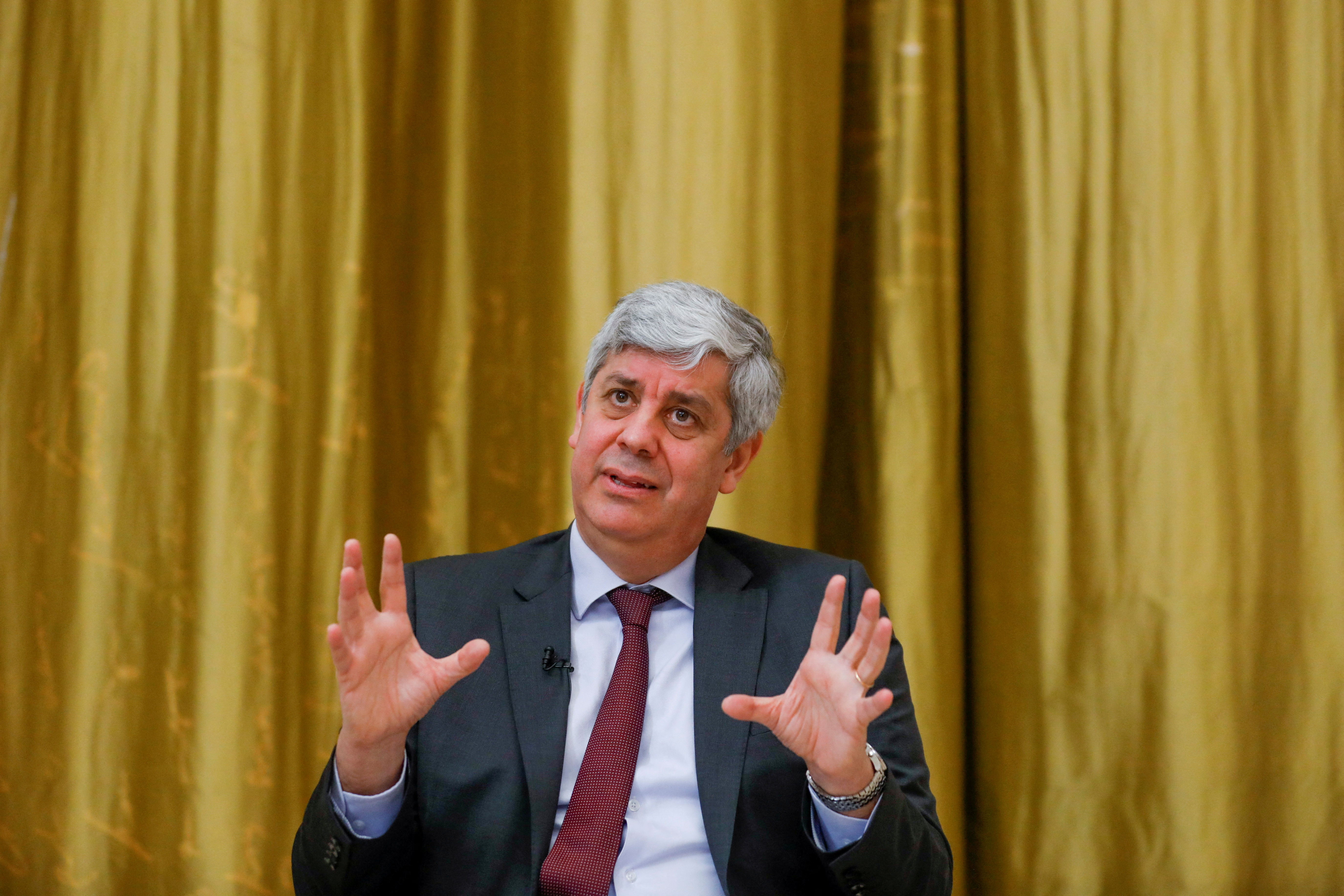 FILE PHOTO: ECB governing council member Mario Centeno speaks during an interview with Reuters, in Lisbon