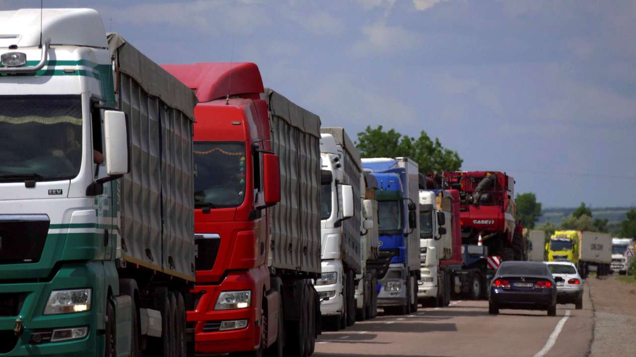 Trucks with grain wait for crossing the Ukraine-Moldova border in Odesa region