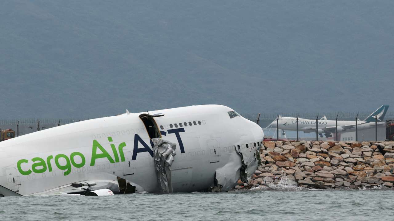 A cargo plane skids off the runway during landing at Hong Kong International Airport