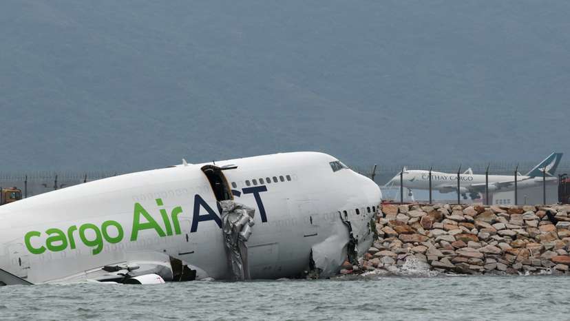 A cargo plane skids off the runway during landing at Hong Kong International Airport
