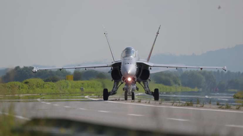 A Swiss Air Force F/A-18 fighter jet lands on the motorway during the Alpha Uno drill in Payerne