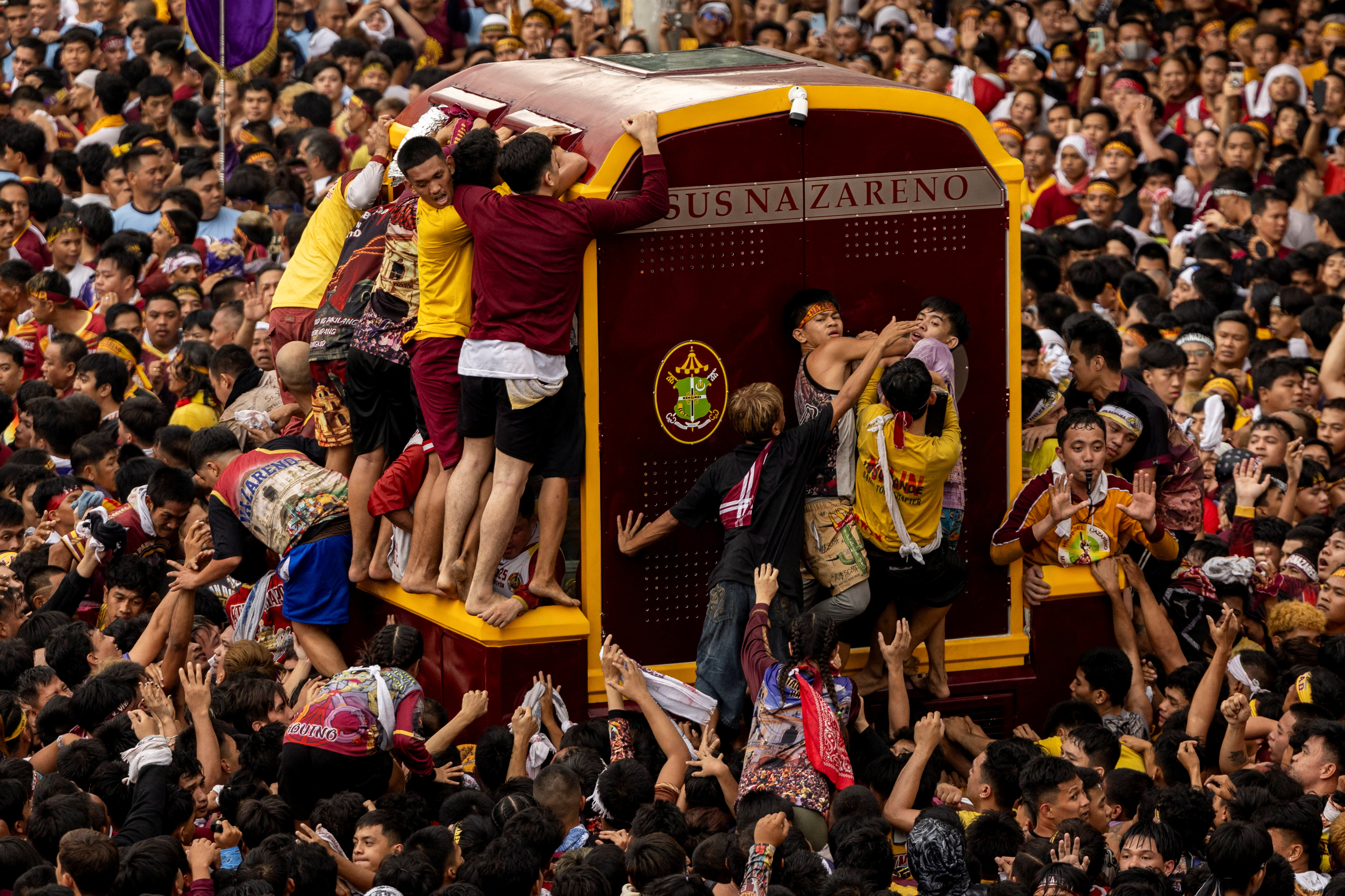 Filipino Catholic devotees parade "Black Nazarene" in celebration of Christ