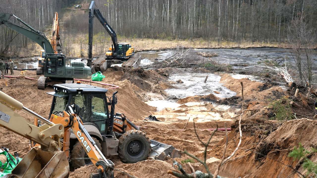 Rescuers dig for missing U.S. soldiers' vehicle in Lithuania