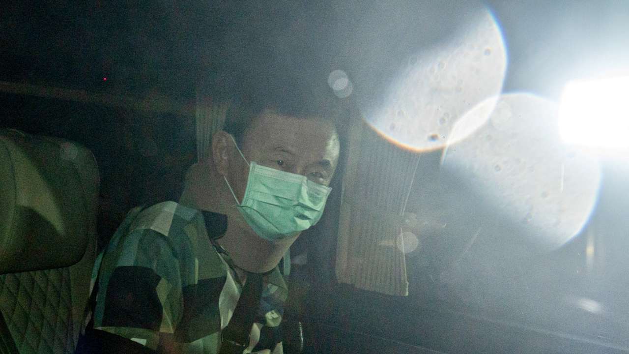 Thailand's former PM Thaksin Shinawatra leaves a police hospital after being granted parole, in Bangkok