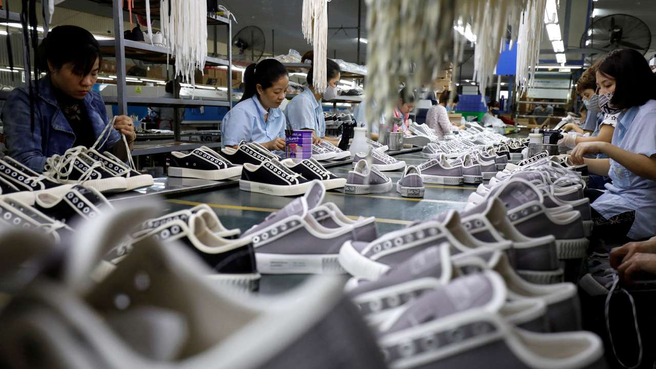 FILE PHOTO: The making of shoes for export at a factory in Hanoi