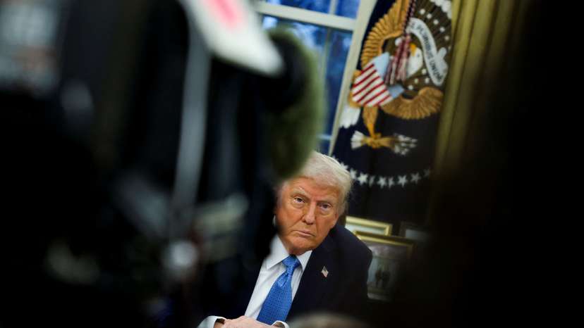 U.S. President Donald Trump signs an executive order in the Oval Office at the White House