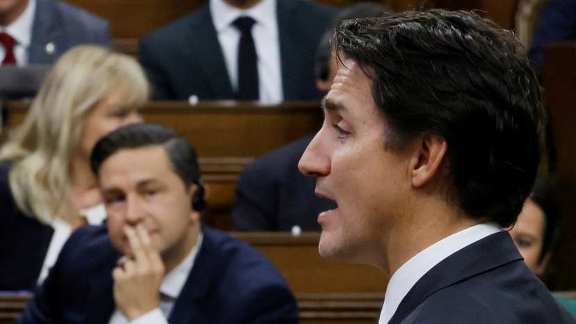 FILE PHOTO: Canada's Prime Minister Justin Trudeau speaks as Conservative Party of Canada leader Pierre Poilievre listens during Question Period in the House of Commons on Parliament Hill in Ottawa