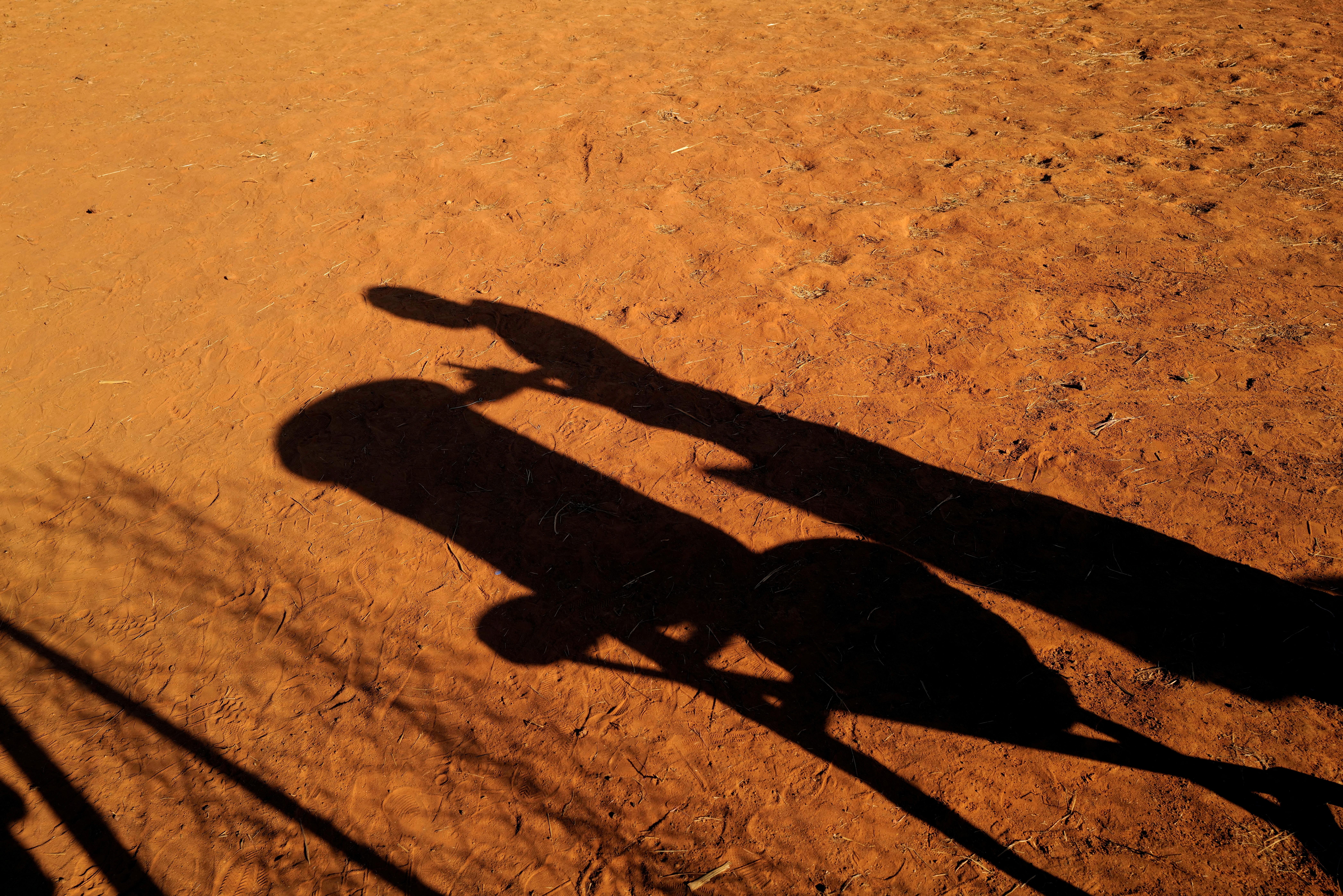 FILE PHOTO: The shadow of a child is seen at a camp for internally displaced people (IDPs) in Kaya