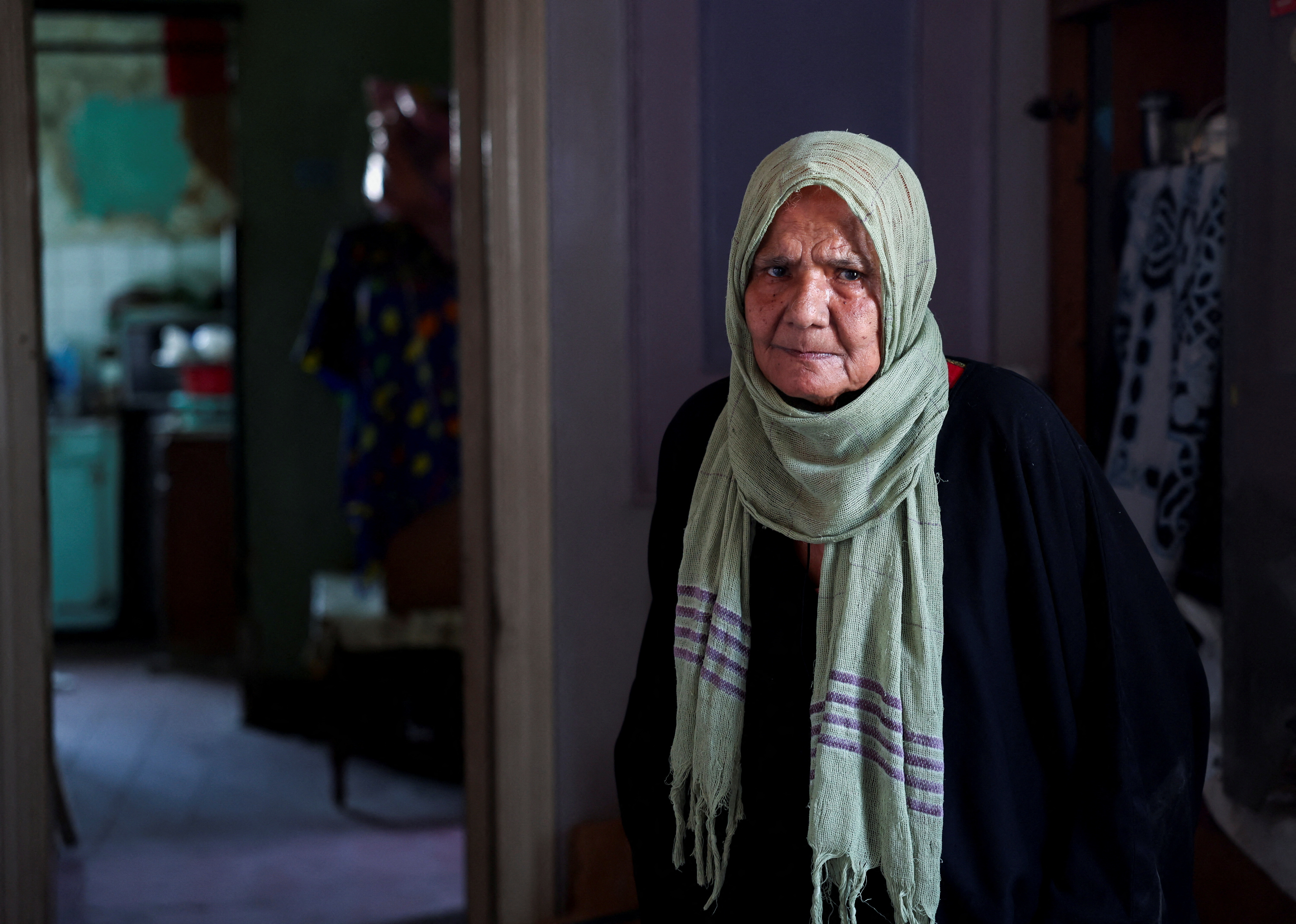 Khaddara Ibrahim Ali, 84, looks on, inside her house, in downtown Cairo