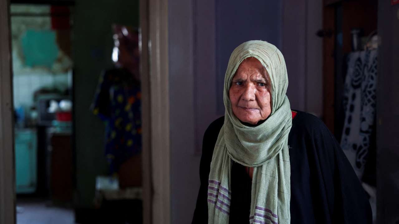 Khaddara Ibrahim Ali, 84, looks on, inside her house, in downtown Cairo