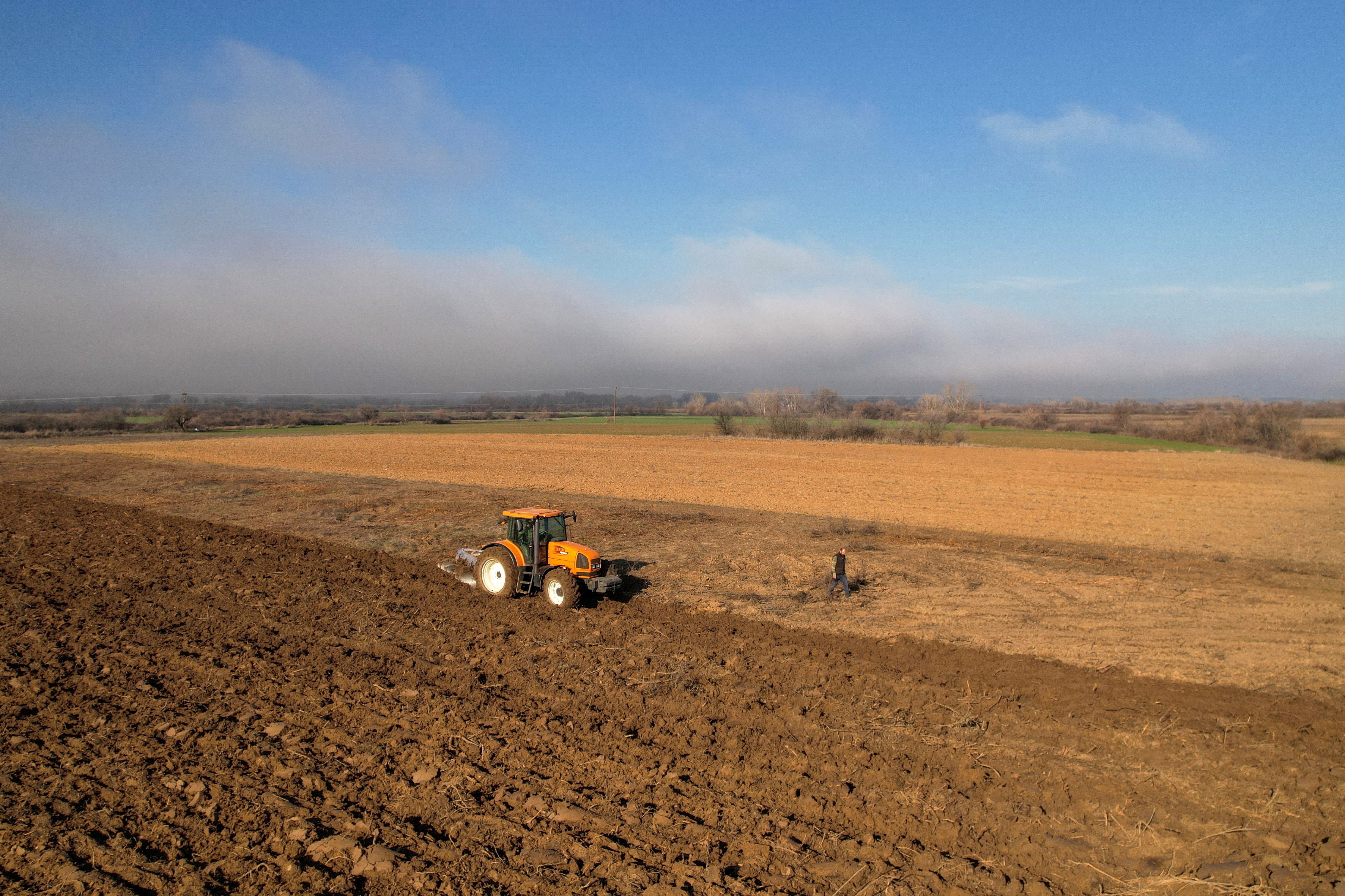 Drone view shows a Greek farmer Dimitris Marinoglou ploughing his field in Kyprinos